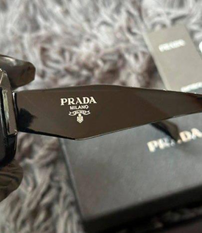 LENTES DE SOL PRADA